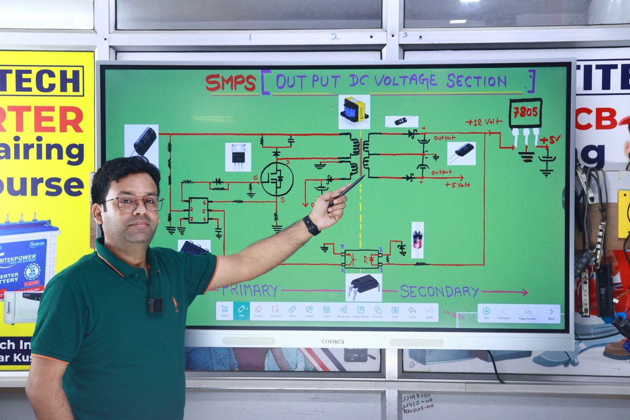 services-02 Instructor explaining SMPS voltage section diagram during AC repair course in New Delhi.